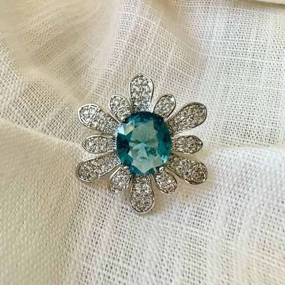 Adjustable light blue oval flower ring